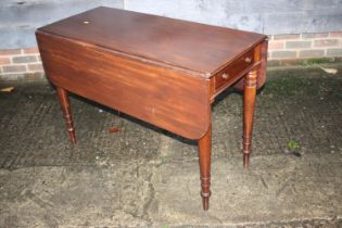 A Cuban mahogany Pembroke table fitted two drawers on turned, ringed and tapered supports, 42 1/2"