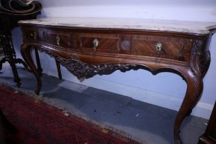 A French style carved walnut serpentine front side table with marble top over two drawers, on