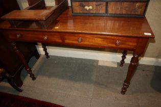 A mahogany side table, fitted two drawers, on turned supports, 48" wide x 20" deep x 31" high