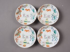 A set of four Chinese porcelain dishes with bat and precious object decoration, all with seal