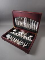A Butler of Sheffield silver plated bead pattern canteen of cutlery, in mahogany case