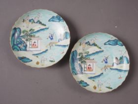 A pair of shaped edge Chinese porcelain dishes, decorated with figures by a river, seal mark to