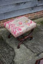 A mahogany 'X' frame stool, upholstered in a kelim style fabric, with turned stretcher