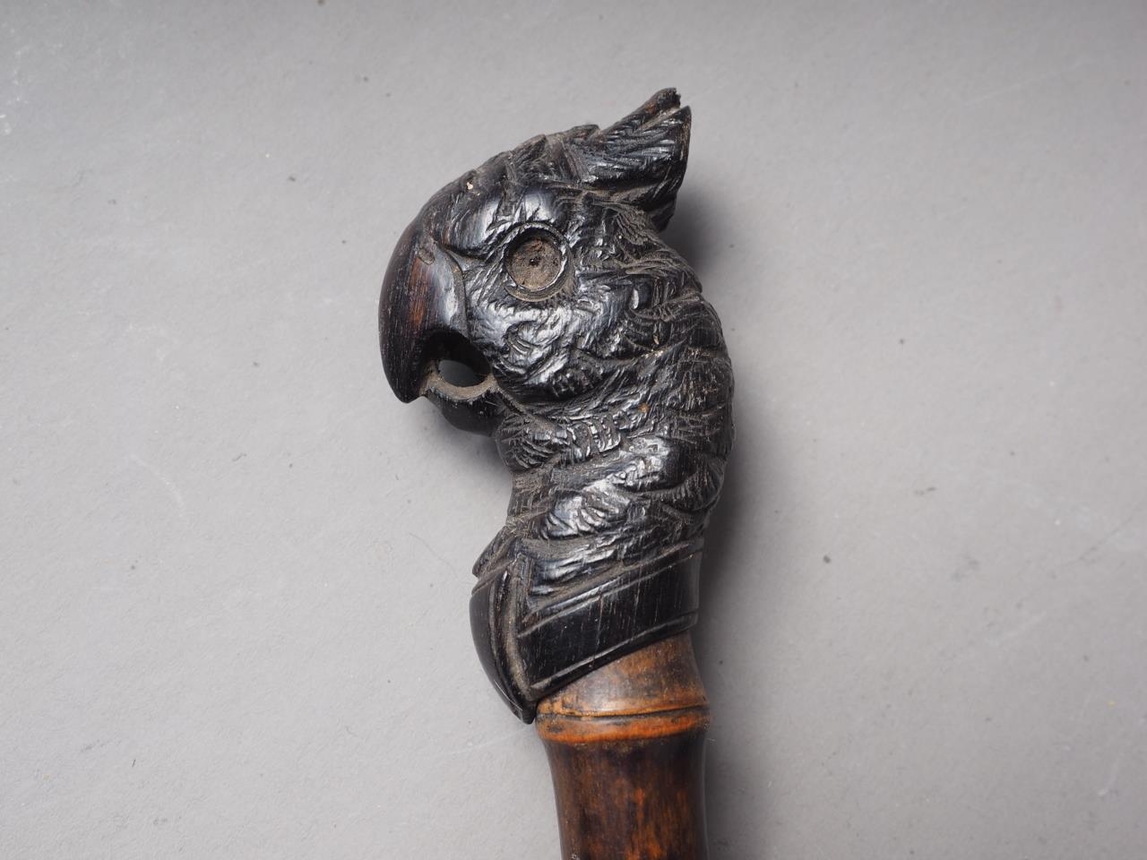 A 19th century carved ebony parrot head parasol handle with bamboo stem, 12" long overall - Image 3 of 3