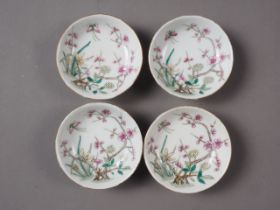 A set of four Chinese porcelain dishes with fruit and flower decoration, four-character mark to