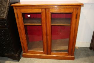 A late 19th century mahogany bookcase enclosed glazed panel doors, on block base, 40" wide x 15"