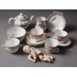 A 1920s Nippon porcelain headed composition doll and a doll's teaset