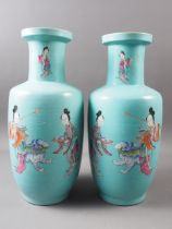 A pair of Chinese porcelain baluster vases with figure, beast and butterfly decoration on a teal