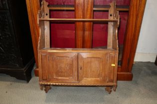 An early 20th century oak wall cupboard, fitted shelf over two doors, 20" wide x 6" deep x 32" high