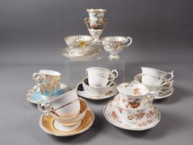 Six mid 19th century floral and gilt scroll decorated cabinet cups and saucers, various designs, and