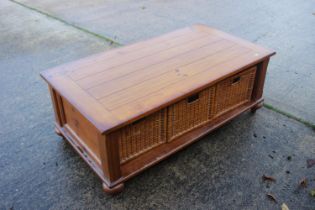 A waxed pine low coffee table, fitted three basket drawers, 50" wide x 27" deep x 17 1/2" high