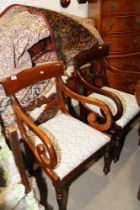 A set of eight early 19th century carved mahogany bar back dining chairs with drop-in seats, on