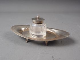 An oval silver desk stand with cut glass inkwell, 1.9oz troy approx