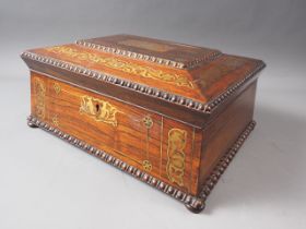 An early 19th century rosewood and brass inlaid work box with lift out tray, on bun feet, 14" wide