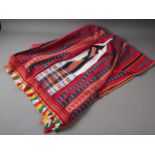 A North African style blanket with zig-zag and striped design, embroidered " Mrs V Derham, Merry X-