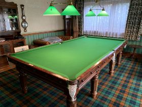 A Cox and Yemen late Victorian mahogany billiard table, on faceted supports, complete with cues,