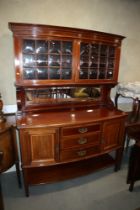An Edwardian Maple & Co Paris, mahogany and satinwood banded bowfront sideboard with glazed cupboard