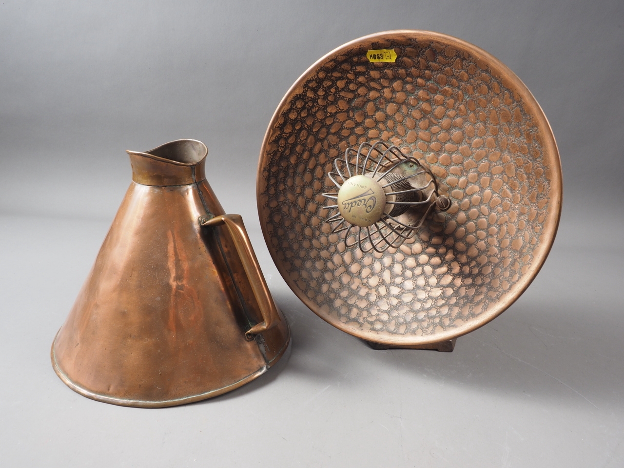 A copper table top heater, by Creda (for ornamental use only) and a copper megaphone