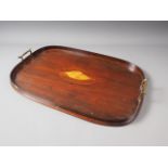 An Edwardian mahogany and shell inlaid oval two-handled tea tray, 22" wide