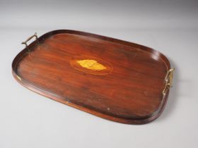 An Edwardian mahogany and shell inlaid oval two-handled tea tray, 22" wide