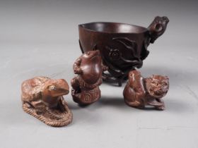 A Chinese hardwood libation cup with relief carved tree, leaf and flower decoration, 3 1/4" high,
