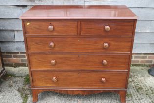 A mid 19th century mahogany chest of two short and three long graduated drawers with knob handles,