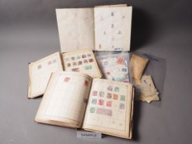 A quantity of mostly loose stamps from around the world, some mounted in albums