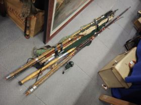 A number of fishing rods, reels and other accessories
