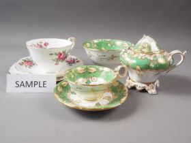 A Royal Crown Staffordshire floral decorated part teaset and 19th century green and gilt decorated