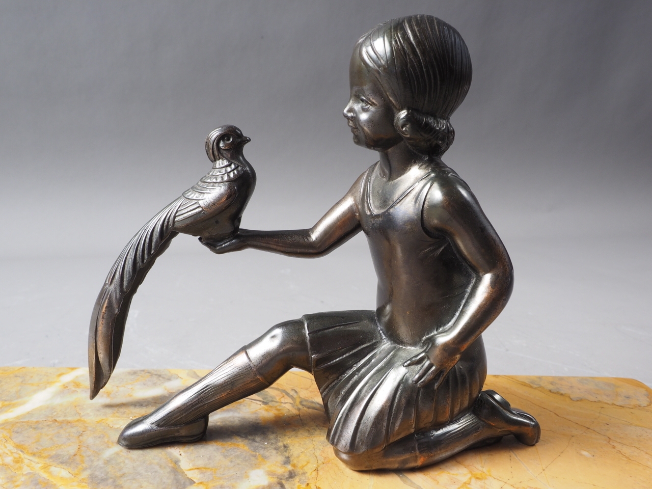 An Art Deco bronzed figure group, girl with bird, on yellow marble base, 11" wide - Image 2 of 3