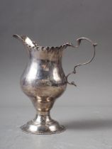 A Georgian silver pedestal cream jug, 3oz troy approx
