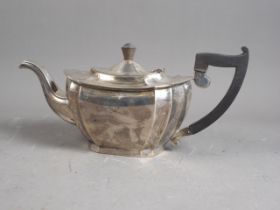 A silver "Queen Anne" style teapot with composition handle, 21.6oz troy gross