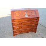 A walnut fall front bureau, fitted three field panel front drawers, 34" wide x 14 1/2" deep x 34"