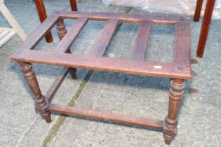 A mahogany luggage stand, on turned supports, 27" wide x 17" deep x 18" high