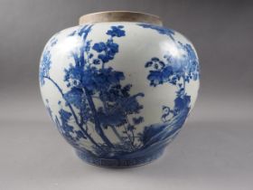 A Japanese porcelain blue and white jar with chrysanthemum and bird decoration, 10 1/2" high