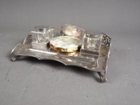 An Edwardian silver desk stand with pierced gallery and two silver mounted square glass inkwells,