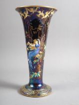 A Wedgwood "Fairyland" lustre trumpet vase, decorated two fairies, birds and imps, incised number
