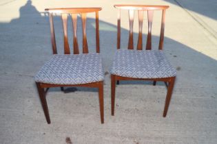 A pair of 1960s walnut standard dining chairs, on tapering supports, two wine tables, on tripod