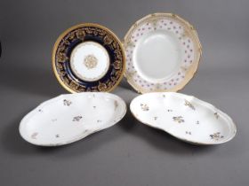 A Royal Doulton bone china gilt decorated cabinet plate, 9" dia, a larger similar plate and a pair