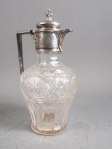 A Walker & Hall silver mounted cut glass claret jug, 10" high