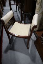 An Edwardian mahogany and inlaid U-seat dressing stool