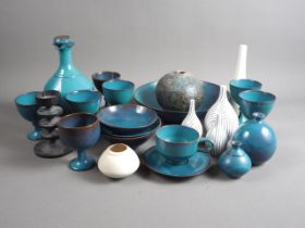 Annette Fuchs: a collection of turquoise glazed studio pottery bowls and goblets, three studio