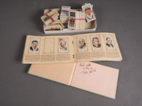 A collection of cigarette cards, mostly loose, an "Album of Film Stars" and an autograph album