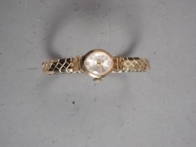 A Lady's "Accolade" 9ct gold cased wristwatch, on bracelet