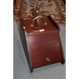 An early 20th century mahogany coal box with brass handle and scoop