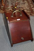 An early 20th century mahogany coal box with brass handle and scoop