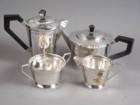 An Art Deco four-piece silver teaset with ebonised knops and handles, a pair of bright cut silver