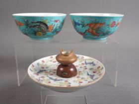 A Chinese porcelain incense dish, decorated bats, 4 3/4" dia, and a pair of tea bowls, decorated