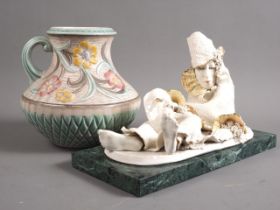An H J Wood Art Deco floral relief decorated jug, 8 1/2" high, and a studio porcelain "Commedia"