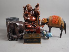 A carved hardwood Hotei with children, 8" high, on stand, a cloisonne pig, two elephant models, etc